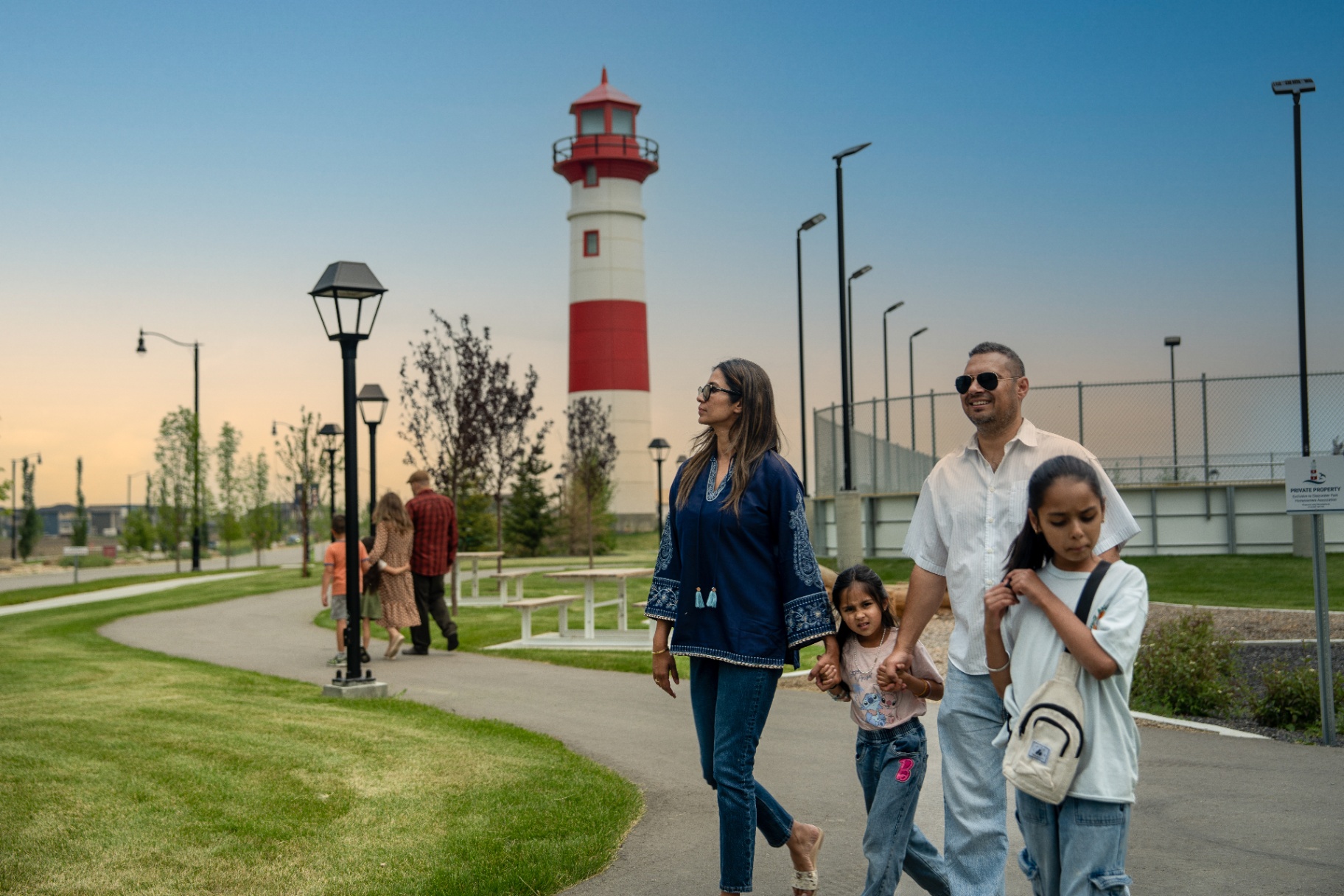 Family walking near the Clearwater Park lighthouse
